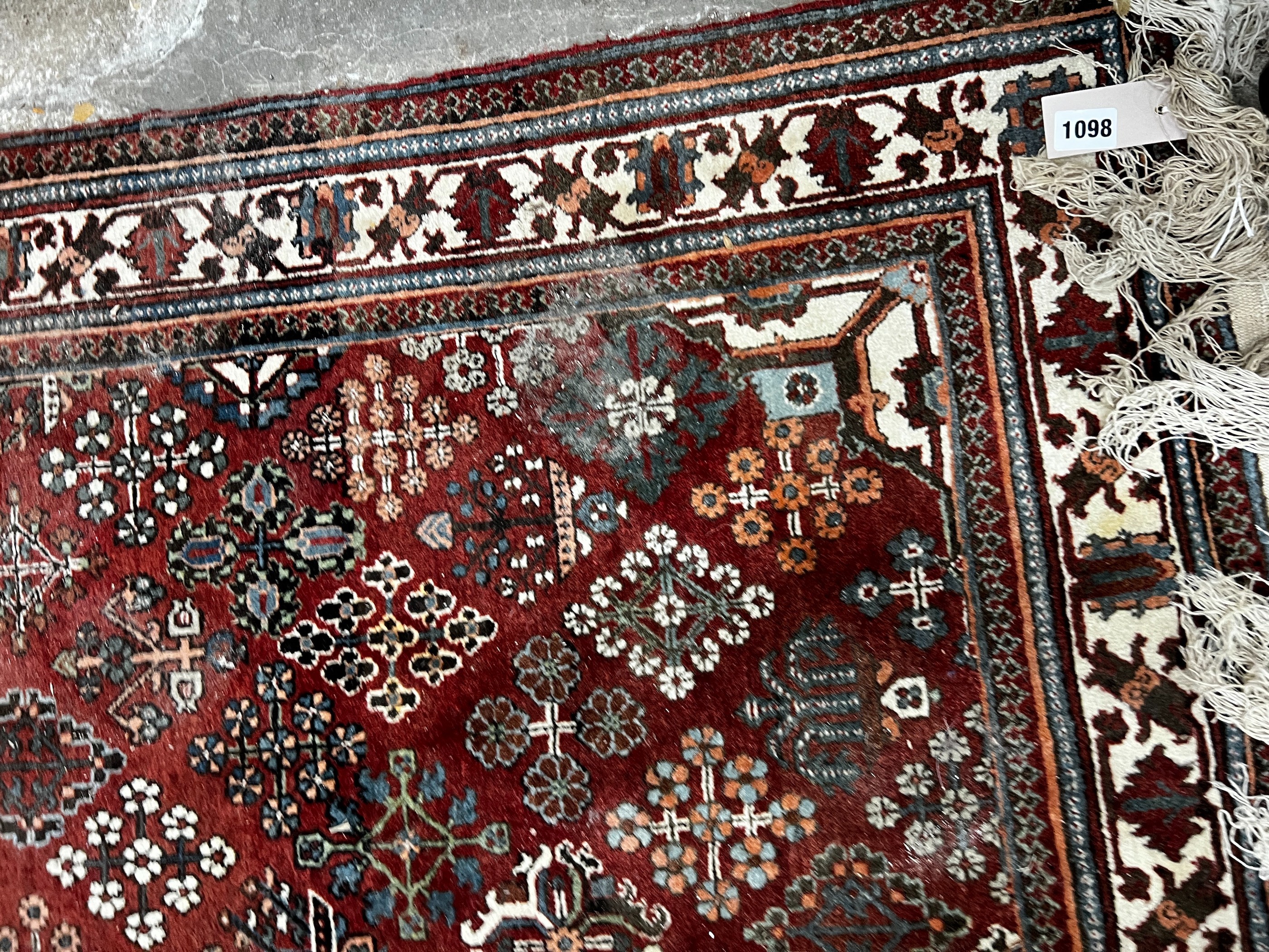 A North West Persian red ground rug, 170 x 116cm
